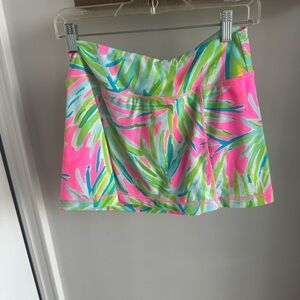 Lilly Pulitzer Luxletic Skort in vibrant pink and green